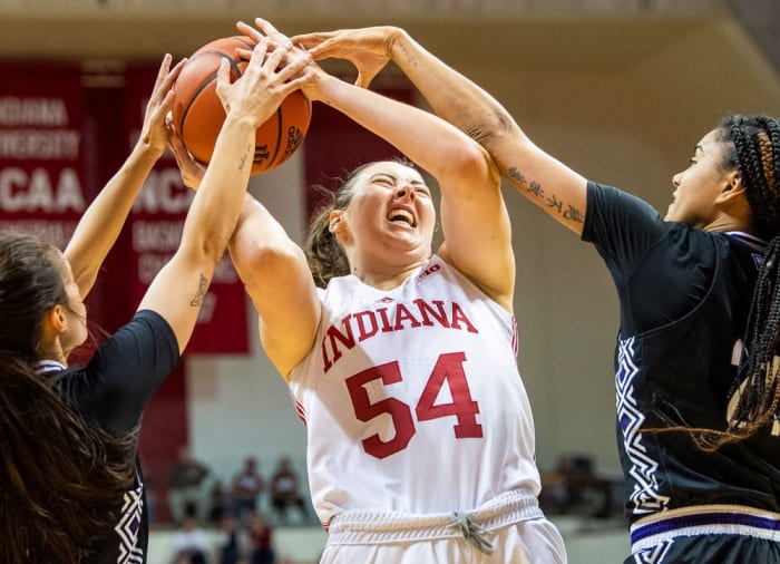 Indiana's Mackenzie Holmes (540 battles a double team during the Indiana versus Kentucky Wesleyan women's basketball game at Simon Skjodt Assembly Hall on Friday, Nov. 4, 2022.